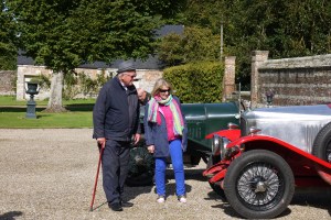 Visitors admire the vintage cars.